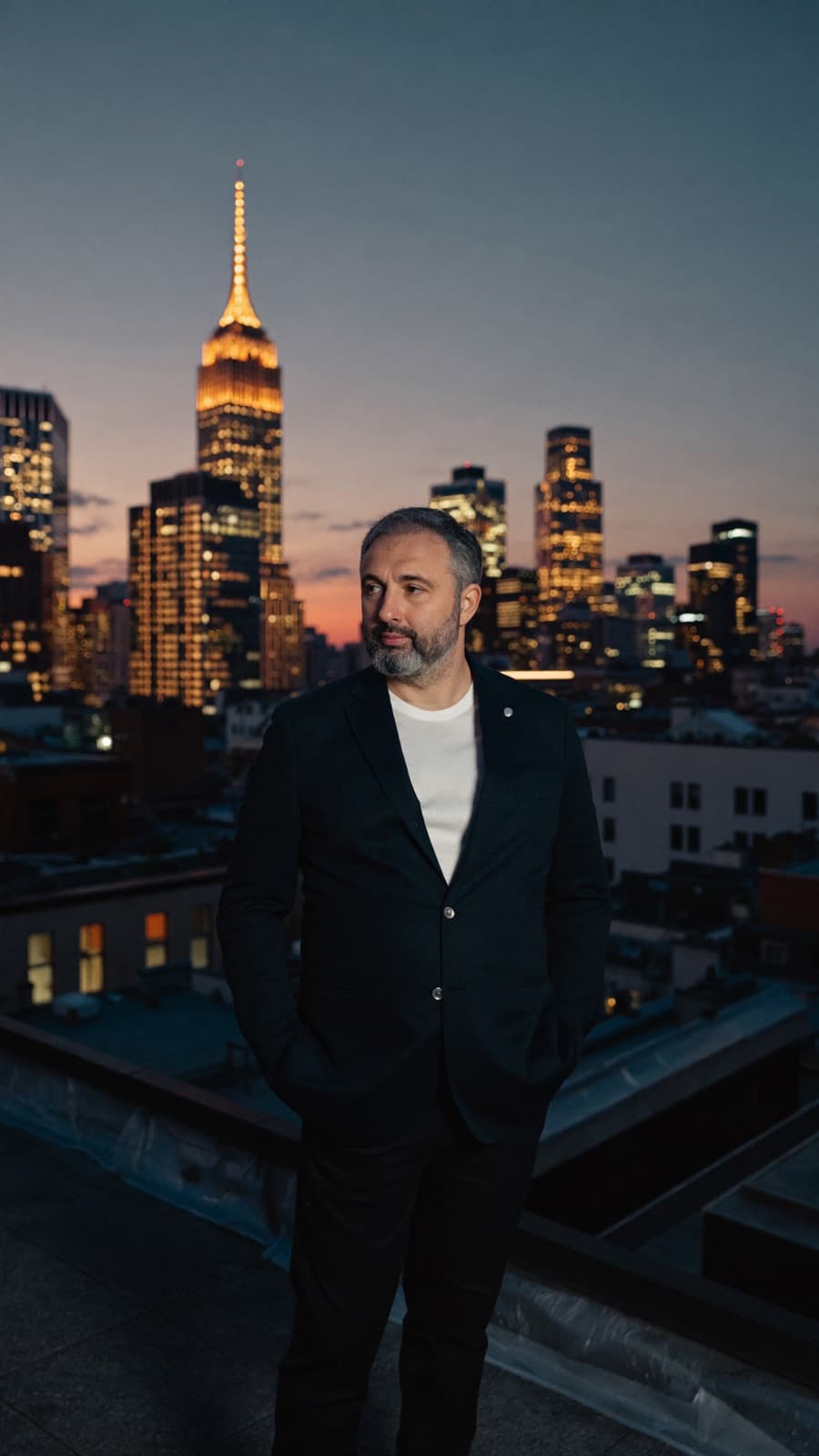 Alex Yanovsky on a rooftop at dusk